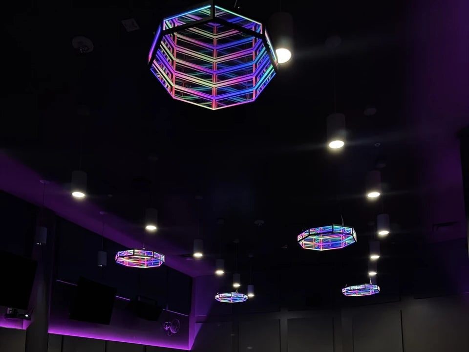 Lit Infinity OctaMirrors hanging above the reformer floor at TruFusion STL