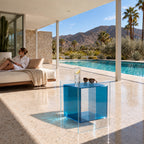 Turquoise Blue Carter Side Table by a daybed in a covered poolside cabana