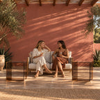 Pair of Coffee Brown Carter Side Tables beside a sofa on a covered garden terrace