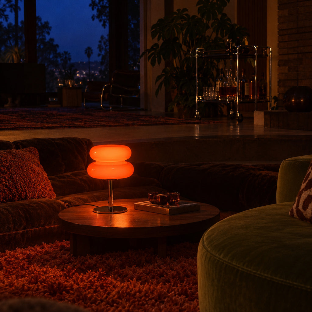 Aprica Table Lamp glowing in a sunken 70s lounge at night with a shag rug and velvet seating
