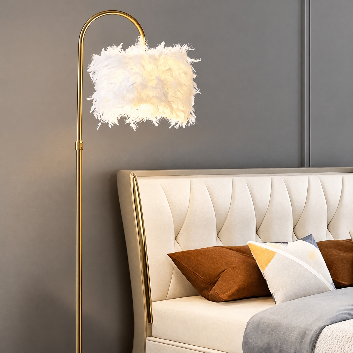 White feather shade glowing beside a cream upholstered bed