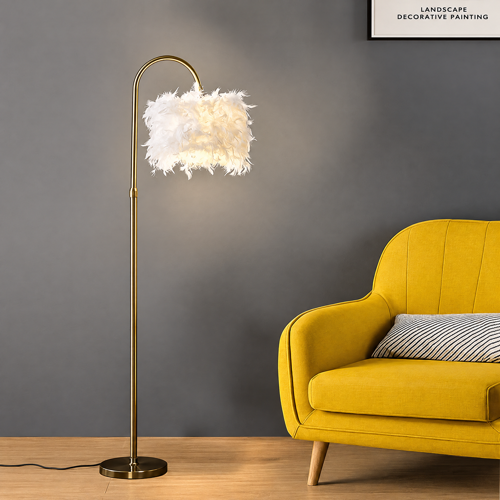 Gold arched feather floor lamp next to a yellow armchair