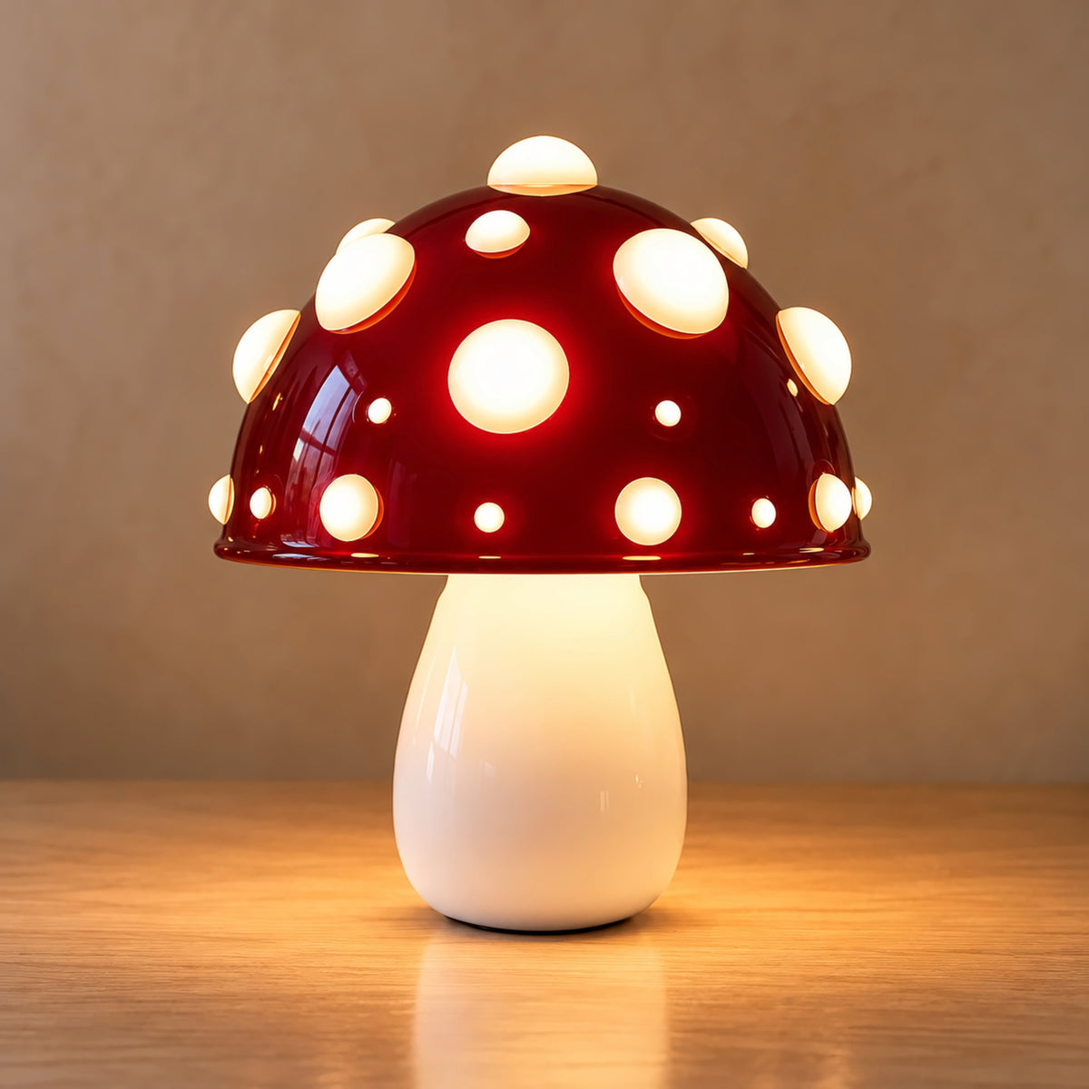 Small red mushroom lamp with white spots on an oak top against a plain warm wall