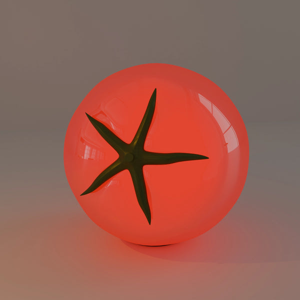 Tomato table lamp glowing red with a green leafy stem