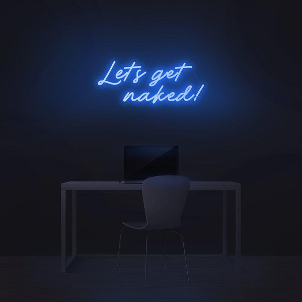 Blue script "Let's get naked!" LED neon sign above a desk