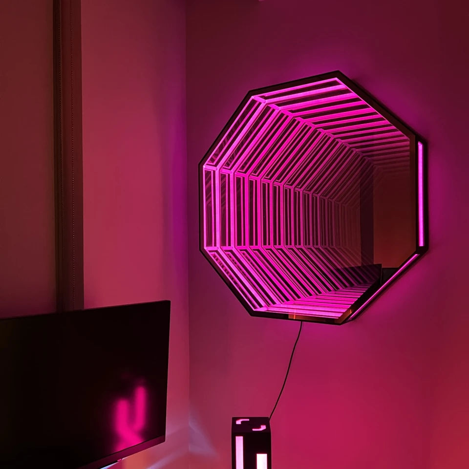An Infinity OctaMirror hung centred above a media cabinet, glowing blue-violet at night