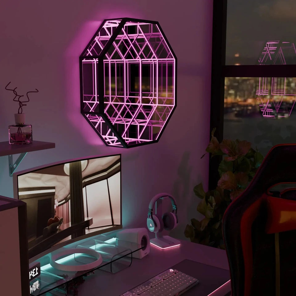 An Infinity OctaMirror glowing pink above a desk setup at night